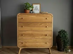 Two-man removal team carefully carrying a chest of drawers downstairs